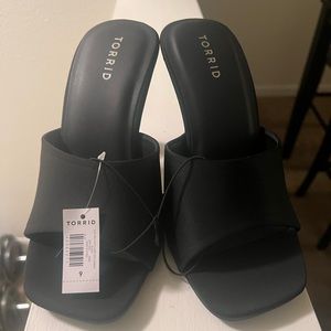 New, never worn. Torrid- black heeled slip on sandal